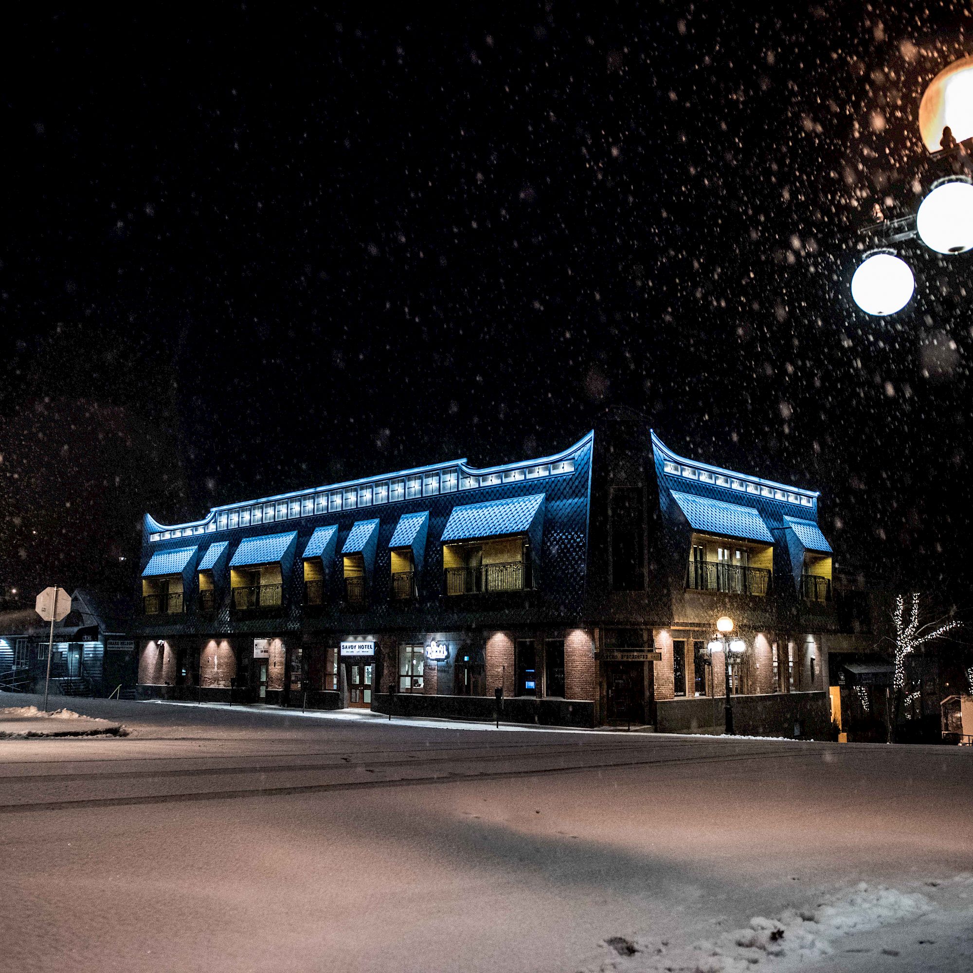 The Savoy Hotel In Nelson BC Lit Up At Nightime
